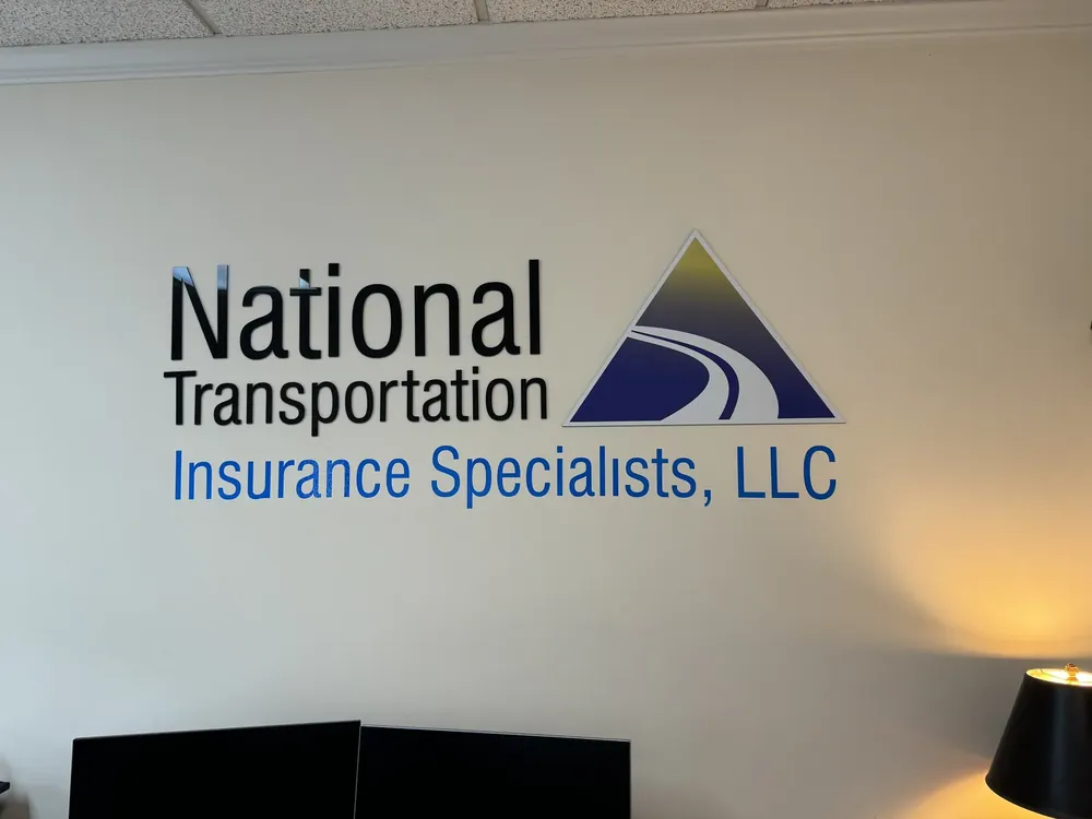 Dimensional logo mounted on an office lobby wall