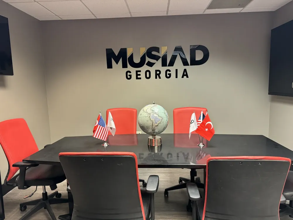 MUSIAD Georgia logo on a conference room wall